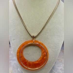 New York & Company Orange Resin and Gold Wire Circle Necklace. 18 inches